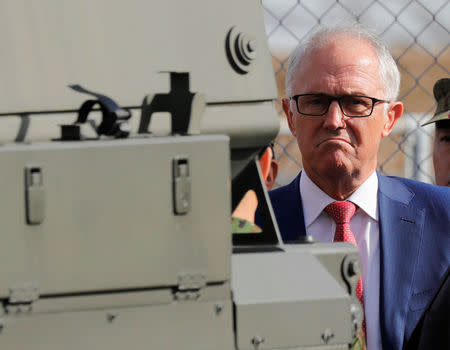 Australian Prime Minister Malcolm Turnbull looks around a Bushmaster military vehicle at Narashino exercise field in Funabashi, east of Tokyo, Japan January 18, 2018. REUTERS/Kim Kyung-Hoon