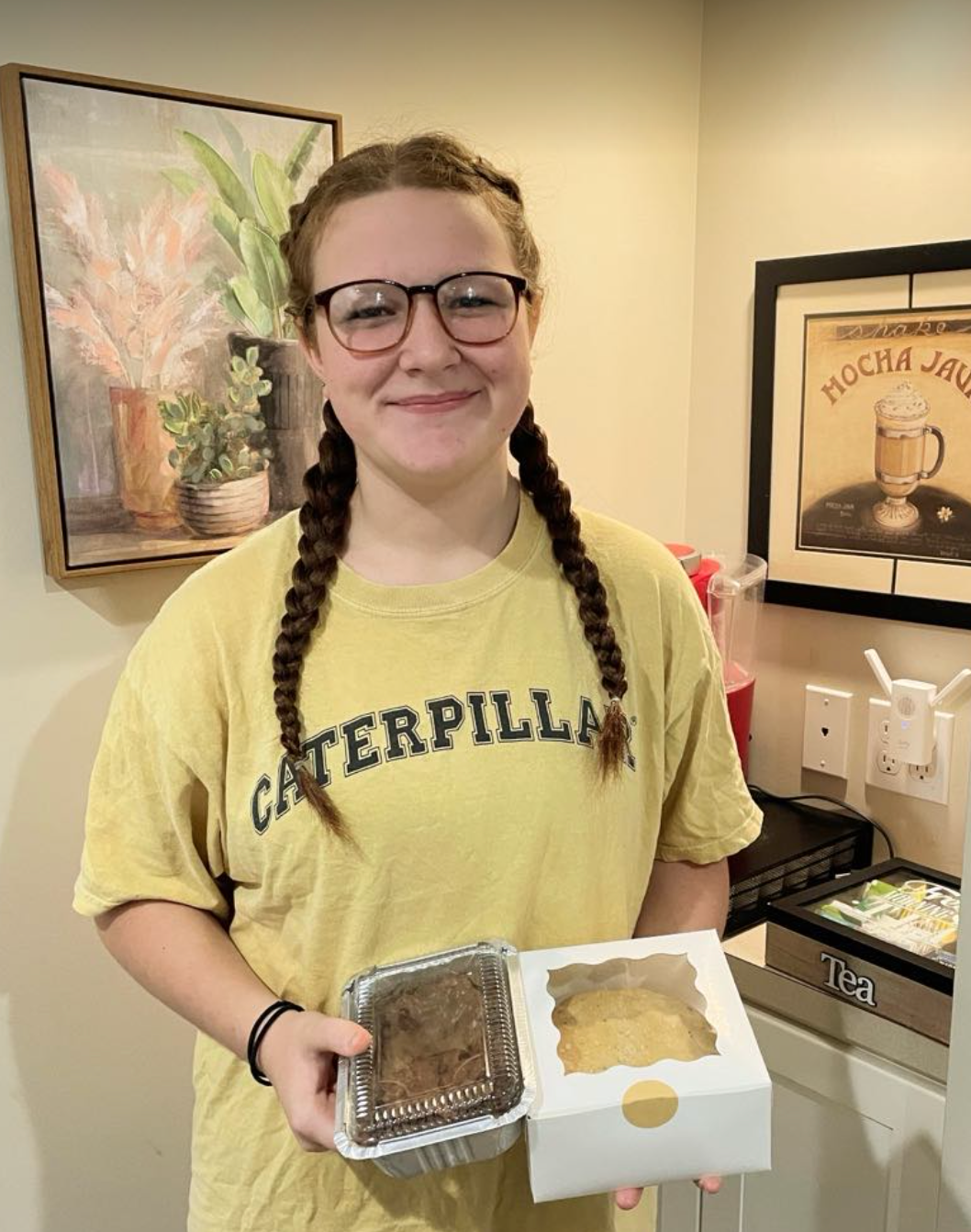 West Ottawa eighth grader Arianna Hamacher is selling homemade cookies and brownies in hopes of paying for a class trip to D.C.