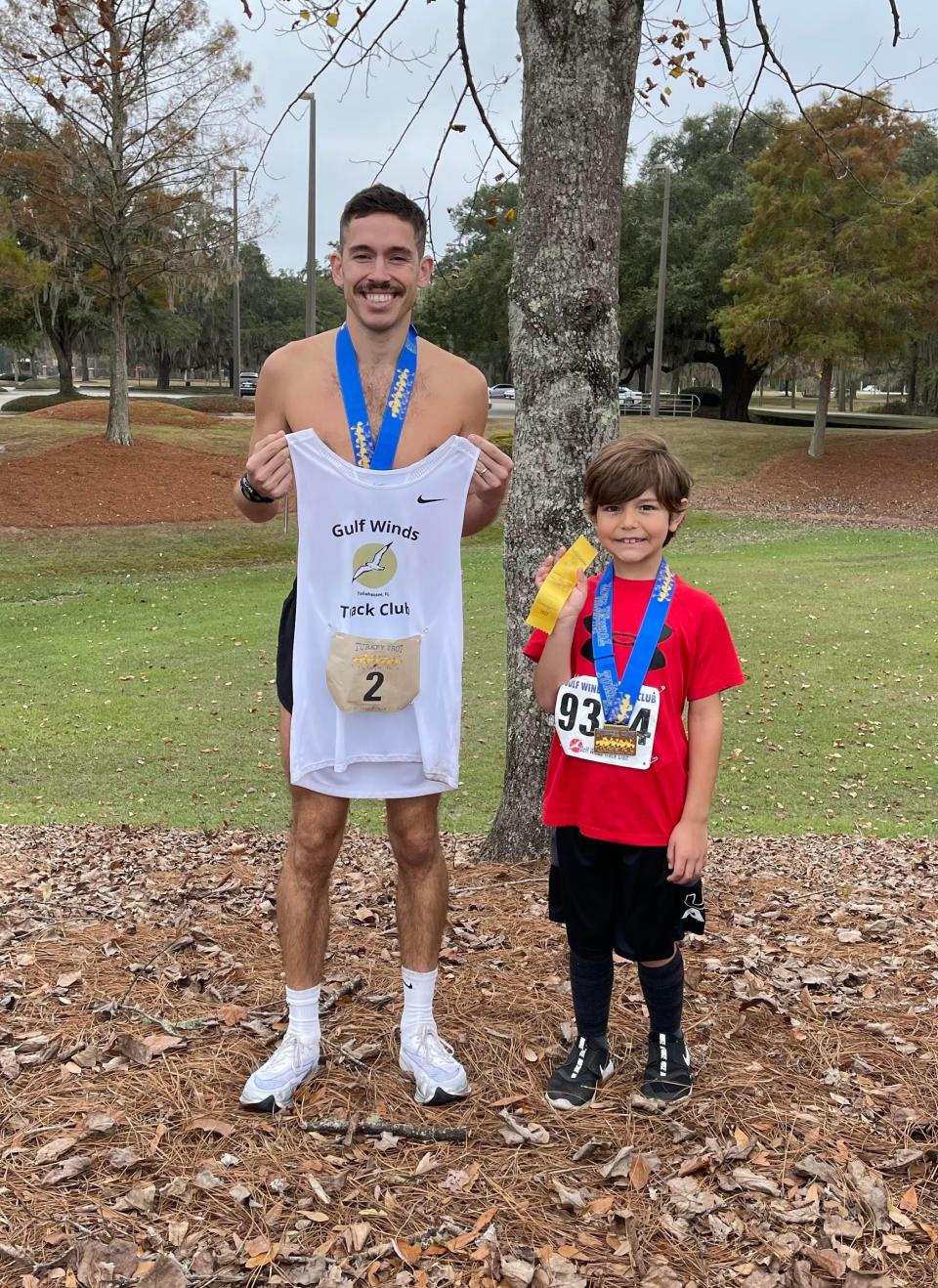 Former FSU and Wakulla runner Stanley Linton, with stepson Jameson, 7, won Thursday's Turkey Trot 15K