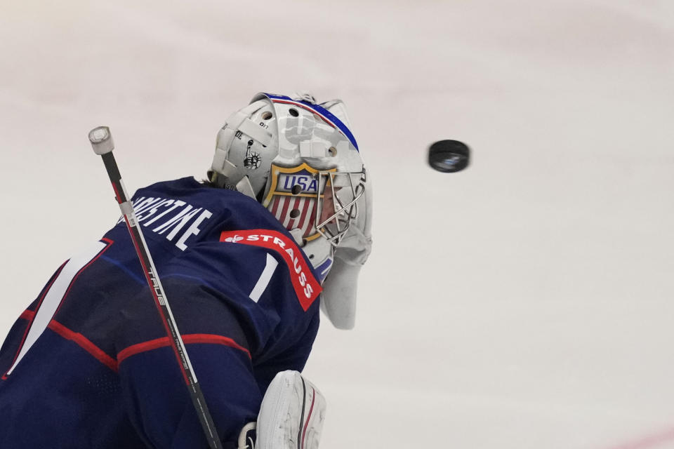 Unted States' goalkeeper Trey Augustine makes a save during the preliminary round match between Poland and United States at the Ice Hockey World Championships in Ostrava, Czech Republic, Friday, May 17, 2024. (AP Photo/Darko Vojinovic)