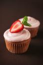 <p>Strawberry fans take note: This luscious cupcake recipe is for you, with a fluffy white cake filled with a sweet strawberry jam center and a thick cream cheese frosting flecked with fresh berries.</p><p><strong><a href="https://www.womansday.com/food-recipes/food-drinks/recipes/a10025/hidden-surprise-cupcakes-121248/" rel="nofollow noopener" target="_blank" data-ylk="slk:Get the recipe.;elm:context_link;itc:0;sec:content-canvas" class="link ">Get the recipe.</a></strong></p>