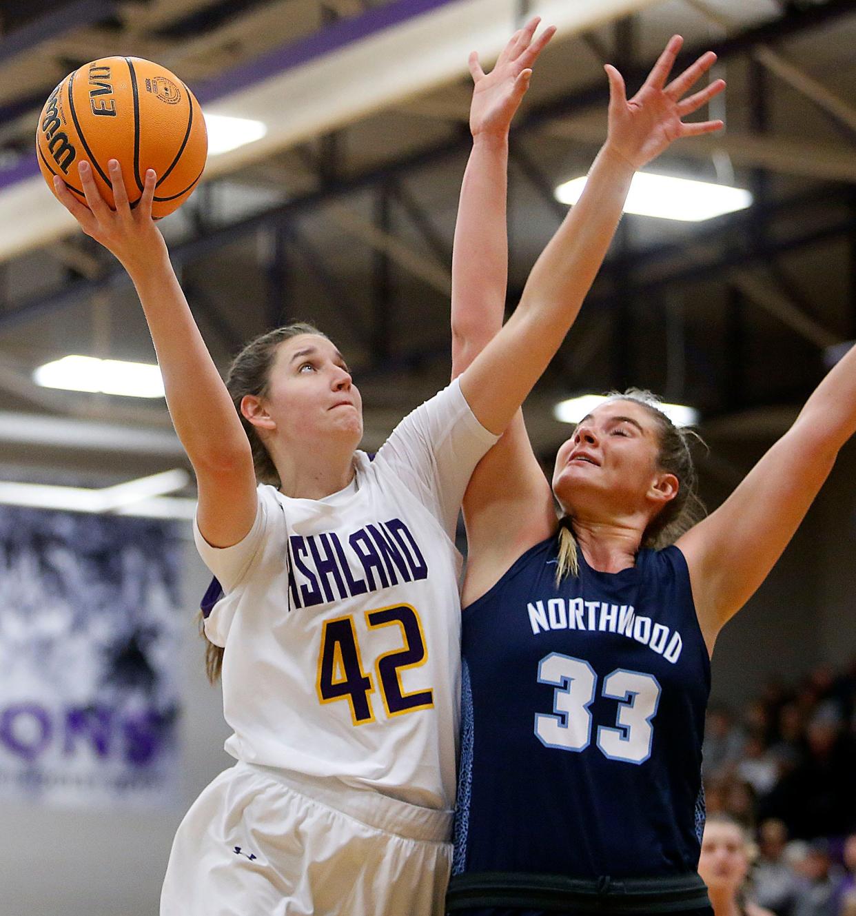 Ashland University's Annie Roshak (42) shoots against Northwood University's Ella Miller during college women's basketball action Saturday, Dec. 10, 2022.