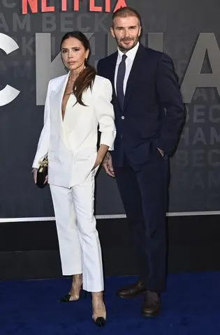 <p>Gareth Cattermole/Getty Images</p> Victoria and David Beckham