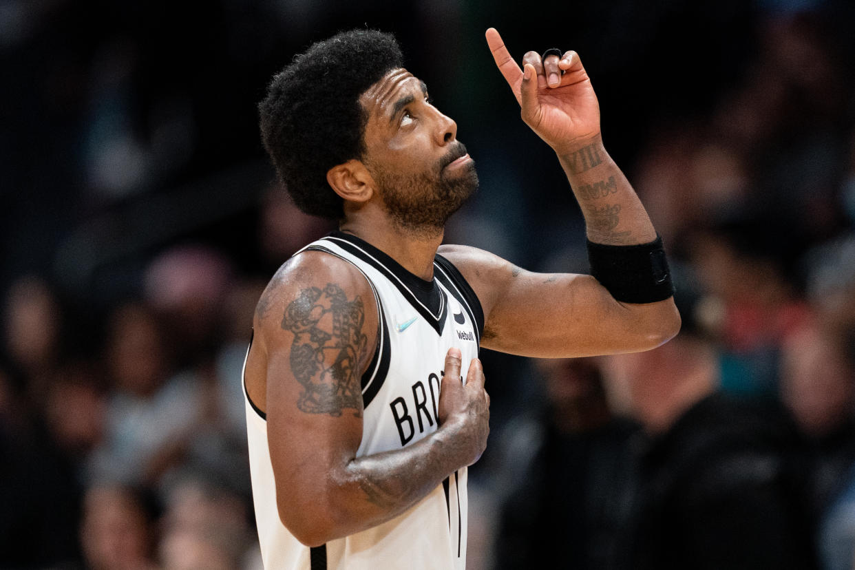 CHARLOTTE, NORTH CAROLINA - MARCH 08: Kyrie Irving #11 of the Brooklyn Nets looks up and points to the sky in the fourth quarter during their game against the Charlotte Hornets at Spectrum Center on March 08, 2022 in Charlotte, North Carolina. NOTE TO USER: User expressly acknowledges and agrees that, by downloading and or using this photograph, User is consenting to the terms and conditions of the Getty Images License Agreement. (Photo by Jacob Kupferman/Getty Images)