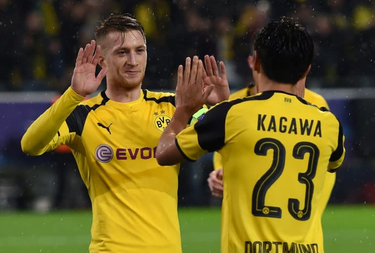 Marco Reus (left) and Shinji Kagawa celebrate a goal in Borussia Dortmund's 8-4 win over Legia Warsaw