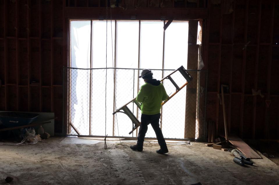 Bill Cannon of Bridgewater retrieves a ladder at the Brockton Senior Center, which is undergoing major renovations that will add more than 4,000 square feet of space to the building.