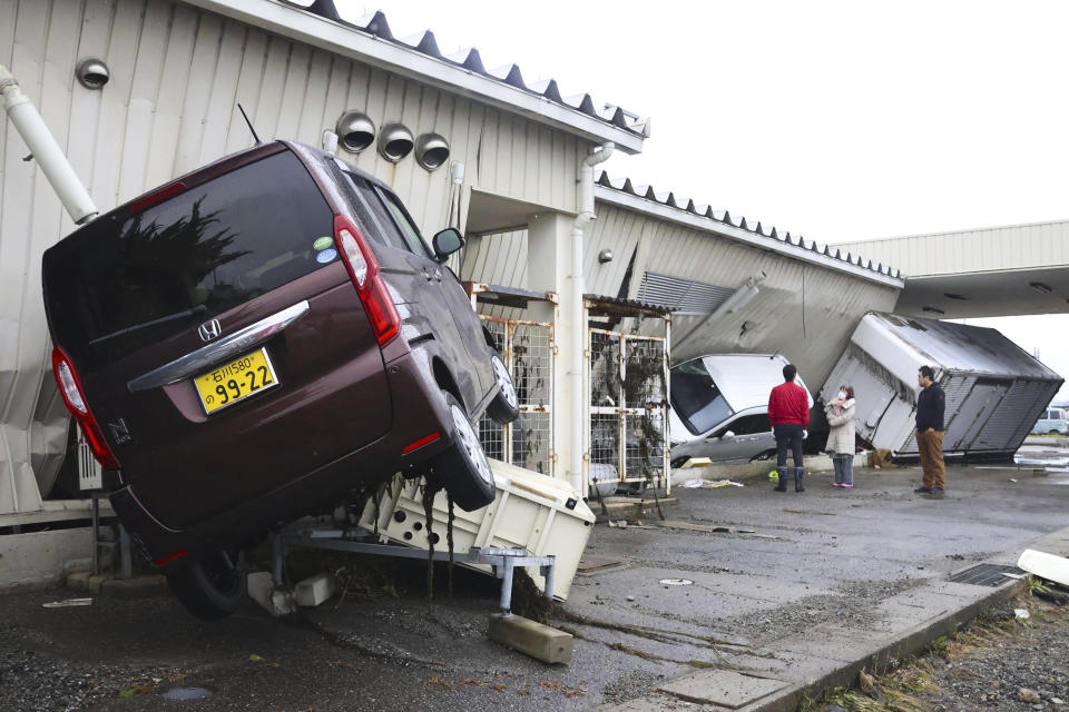 The cars are seen damaged as the city was hit by the earthquakes and tsunami in Suzu, Ishikawa prefecture, Japan Wednesday, Jan. 3, 2024. (Kyodo News via AP)