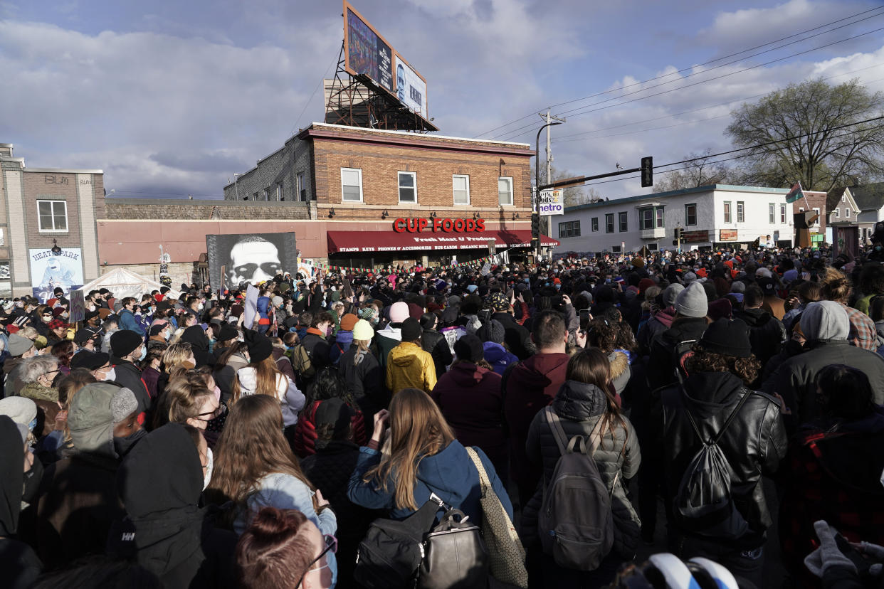 People gather at Cup Foods on April 20 after a guilty verdict was announced at the trial of former Minneapolis police Officer Derek Chauvin for the 2020 death of George Floyd. (Morry Gash/AP)