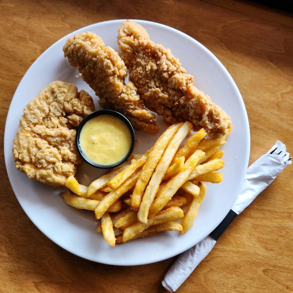 A daily special of chicken strips with fries and a dipping sauce is served at the Frontier Restaurant and Bar in Daylight on Wednesday, July 19, 2023.