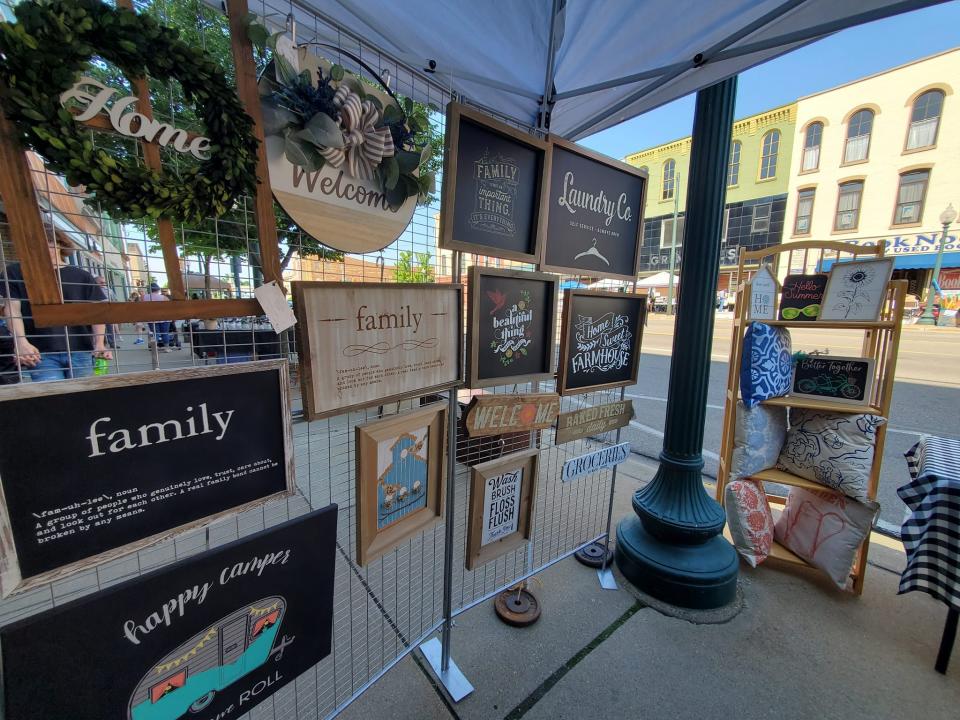 A vendor booth from last year's Open Air Market and Music Festival is shown.