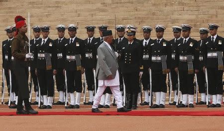 Nepal's Prime Minister Khadga Prasad Sharma Oli inspects a guard of honour during his ceremonial reception at the forecourt of Rashtrapati Bhavan in New Delhi, India, February 20, 2016. REUTERS/Adnan Abidi