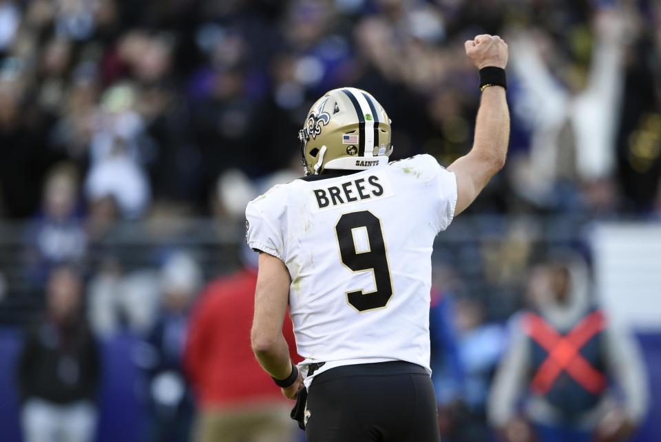 New Orleans Saints quarterback Drew Brees celebrates after throwing his 500th career touchdown pass in the first half of an NFL football game against the Baltimore Ravens, Sunday, Oct. 21, 2018, in Baltimore. (AP Photo/Nick Wass)