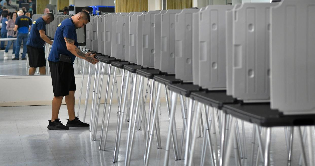 Elections office staff in Palm Bay set up for early voting for the Republican presidential primary on March 19.