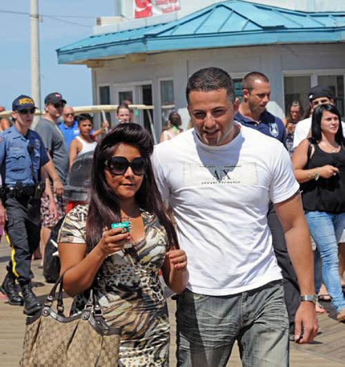 <div class="caption-credit"> Photo by: HowAboutWe</div><div class="caption-title">Snooki and Jeff Miranda</div>Back when <i>Jersey Shore</i> was the biggest thing on TV, everyone wanted a piece of the action. That included Jeff Miranda, a "juicehead Guido" who briefly dated Snooki. Trying to make the most of his fifteen minutes, Miranda went on the cover of Steppin' Out, a magazine dedicated to the Jersey club scene, and proposed to Snooks in the headline. <br> <br> <b>HAPPILY EVER AFTER?</b> Snooki said "no." Not long after, she met Jionni LaValle. The couple are now engaged and have a newborn son, Lorenzo.