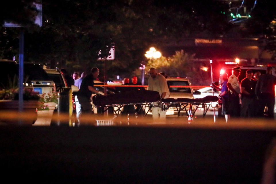 Bodies are removed from at the scene of a mass shooting, Sunday, Aug. 4, 2019, in Dayton, Ohio. Several people in Ohio have been killed in the second mass shooting in the U.S. in less than 24 hours, and the suspected shooter is also deceased, police said. (Photo: John Minchillo/AP)