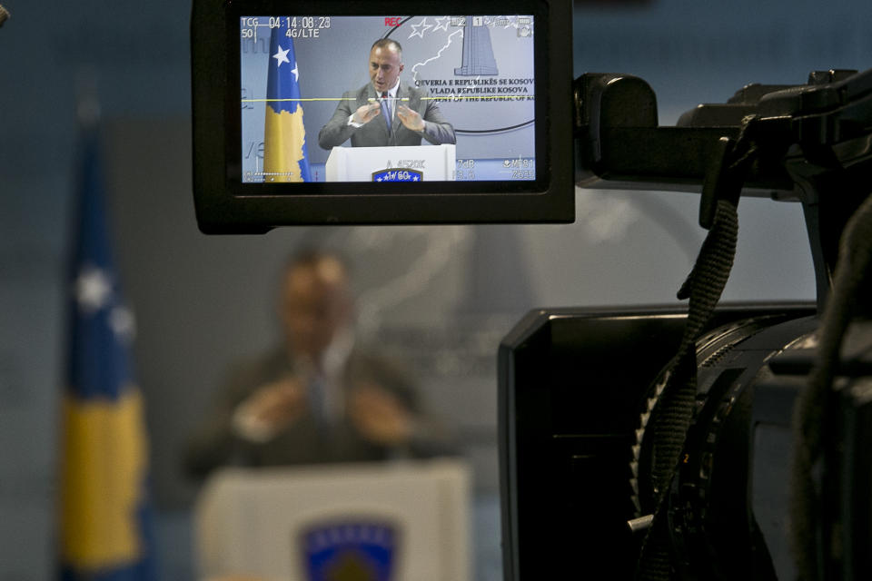 Kosovo prime minister Ramush Haradinaj, seen on a camera monitor as he speaks to the media in the Kosovo capital Pristina on Tuesday, Dec. 18, 2018. Haradinaj blamed Europe Union's foreign policy chief for "deviating the dialogue" on normalizing ties with Serbia. Haradinaj said that, while Serbia is taking major steps toward the integration with the bloc, his country's residents have remained "in a ghetto," not enjoying the visa-free travel to EU countries though it has fulfilled all requirements. (AP Photo/Visar Kryeziu)