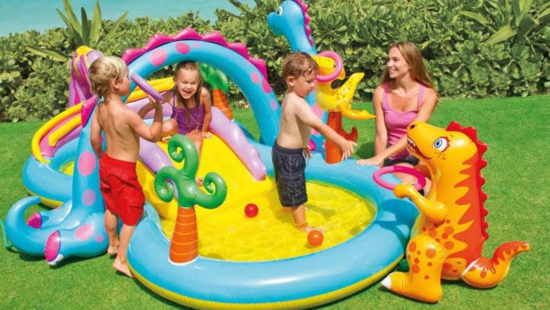 This colorful dinosaur water park is one of the most adorable things your children will own.