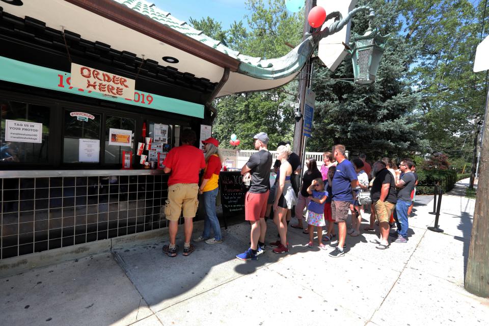 People wait in line to order food during the 100th anniversary celebration at Walter's Hot Dog Stand in Mamaroneck Aug. 25, 2019. Hundreds turned out for the anniversary celebration, which included live music, a hot dog eating contest, games for kids, and lots of hot dogs. 