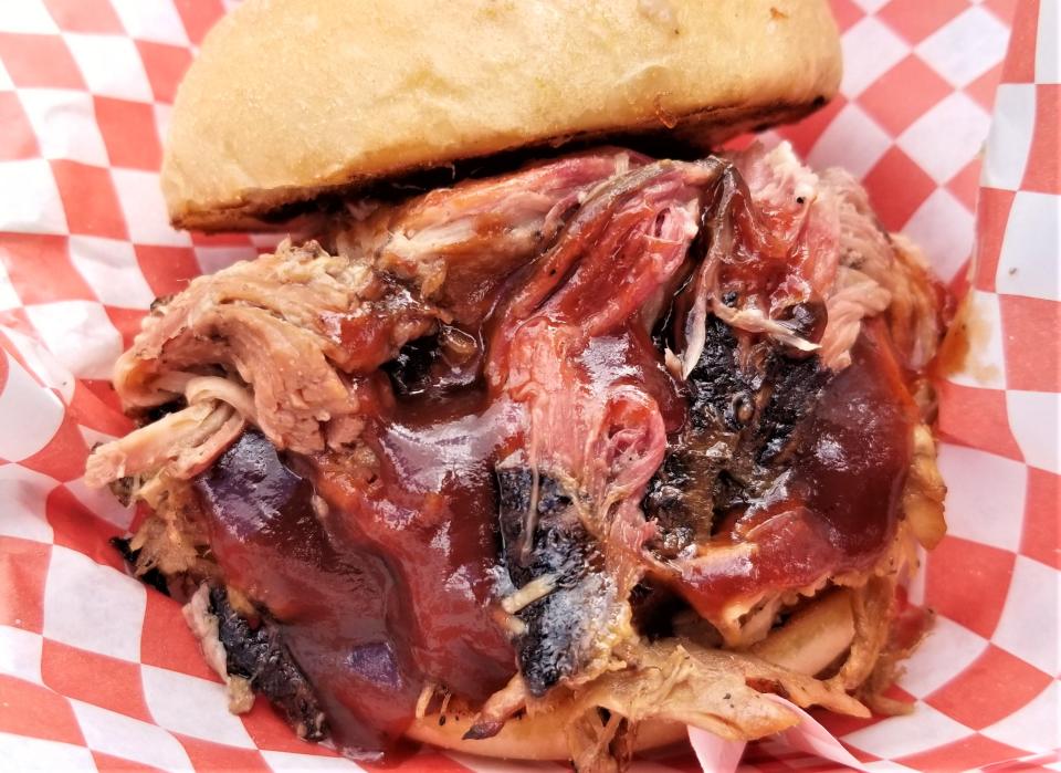 Lines formed throughout the day for items such as this pulled pork sandwich at Lora Rust Wolters' Smokin’ Momma Lora’s BBQ food truck during the Manatee Pride festival on Saturday, March 5, 2022. Smokin’ Momma Lora’s BBQ is scheduled to appear this Saturday at the Cigar Box Guitar & Food Truck Festival at Big Top Brewing in Sarasota.