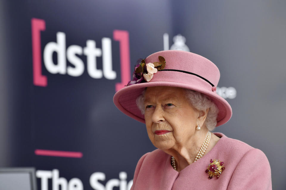 Britain's Queen Elizabeth II visits the Defence Science and Technology Laboratory (DSTL) at Porton Down, England, Thursday Oct. 15, 2020, to view the Energetics Enclosure and display of weaponry and tactics used in counter intelligence. (Ben Stansall/Pool via AP)