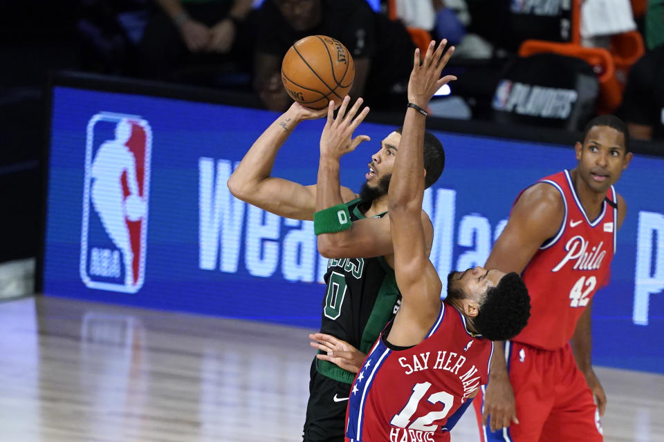 Aug. 17, 2020; Lake Buena Vista, Florida; Boston Celtics forward Jayson Tatum (0) shoots against Philadelphia 76ers forward <a class="link " href="https://sports.yahoo.com/nba/players/4901" data-i13n="sec:content-canvas;subsec:anchor_text;elm:context_link" data-ylk="slk:Tobias Harris;sec:content-canvas;subsec:anchor_text;elm:context_link;itc:0">Tobias Harris</a> (12) in the second half in game one of the first round of the 2020 NBA Playoffs at The Field House. Ashley Landis-USA TODAY Sports