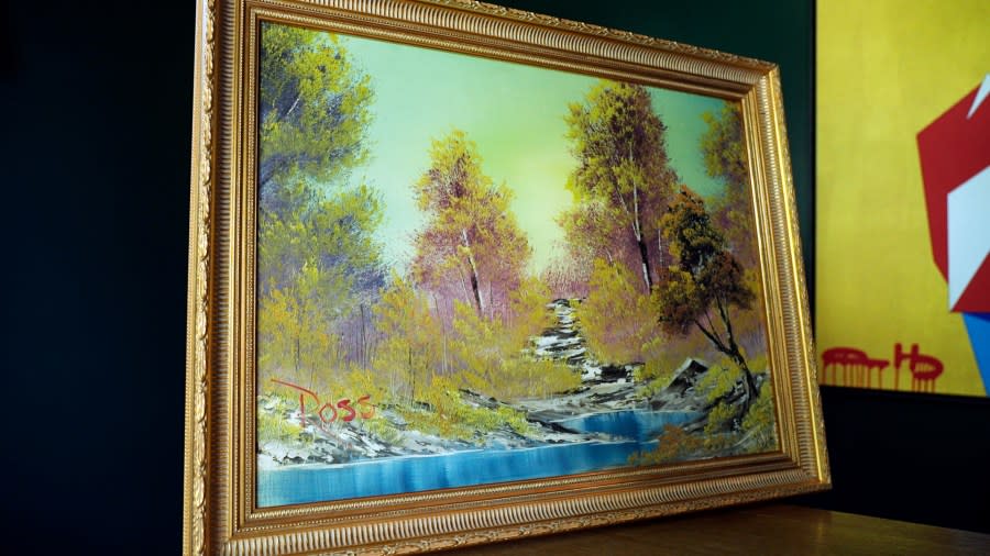 “A Walk in the Woods,” the first painting Bob Ross produced for hic iconic show “The Joy of Painting,” sits on display at the home of Modern Artifact owner Ryan Nelson, Tuesday, Sept. 19, 2023, in Wayzata, Minn. Ross was known for his unpretentious approach to painting on his long-running show, “The Joy of Painting,” but now the painting he completed on his first show in 1983 is for sale for nearly $10 million. Minneapolis gallery owner Ryan Nelson calls it the “rookie card” for Ross. (AP Photo/Mark Vancleave)