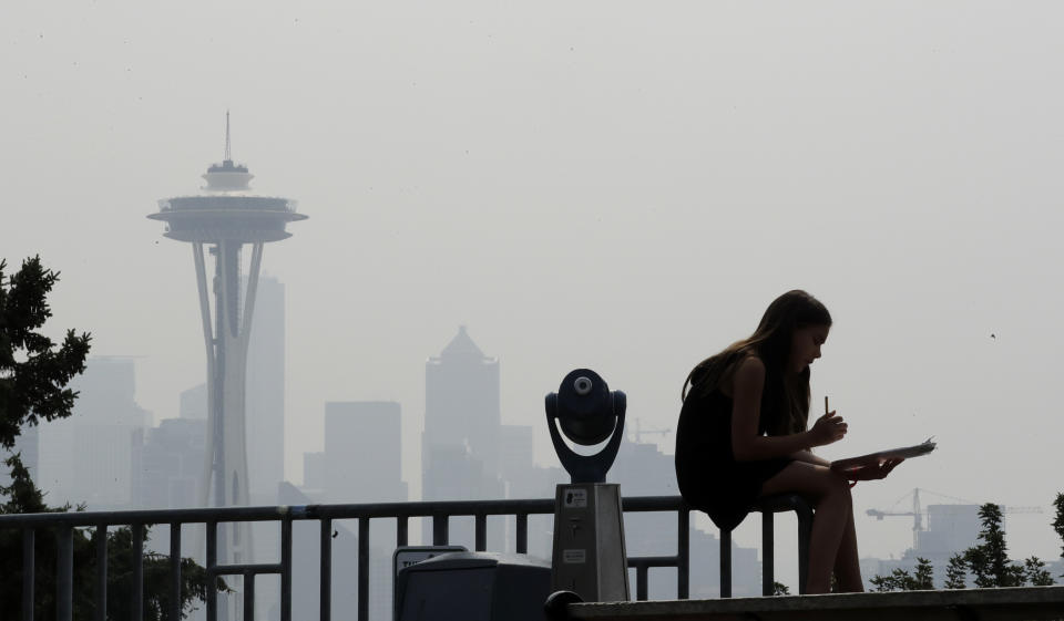 A photo shows the&nbsp;smoky haze that obscured the Space Needle and downtown Seattle in August 2018. (Photo: ASSOCIATED PRESS)