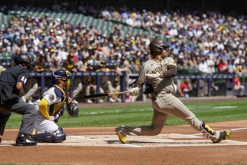 San Diego Padres' Juan Soto hits a single during the first inning of a baseball game against the Milwaukee Brewers Sunday, Aug. 27, 2023, in Milwaukee. (AP Photo/Morry Gash)