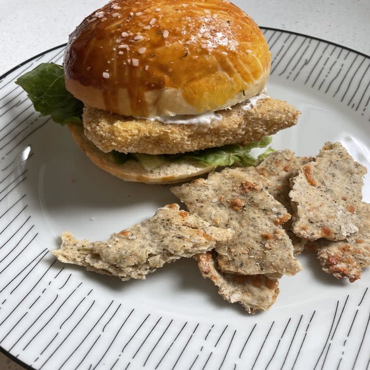 Chicken sandwiches with crackers on a plate