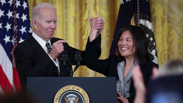 PHOTO: U.S. President Joe Biden links arms with Julie Su, his nominee to be the next Secretary of Labor during an event in the East Room of the White House, March 1, 2023, in Washington. (Win Mcnamee/Getty Images)