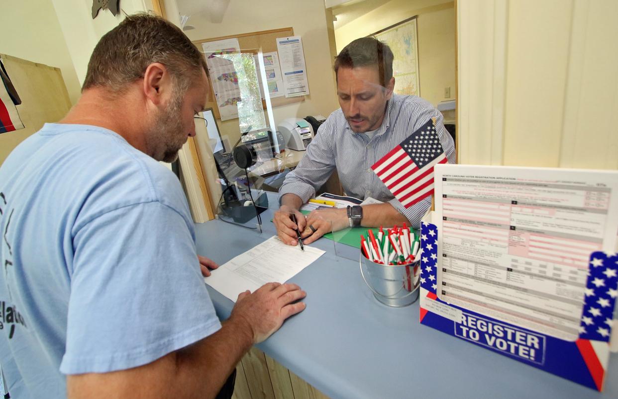 Director of Elections Clifton Philbeck helps Keith Gillis, left, with his paperwork as he files to run for Lawndale City Council Monday afternoon, July 10, 2023, at the Cleveland County Board of Elections in Shelby.