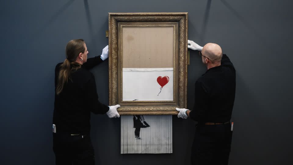 Banksy's "Love In The Bin" passed through a hidden shredder seconds after the hammer fell at Sotheby's Contemporary Art Evening Sale on October 5, 2018. - Alexander Scheuber/Getty Images