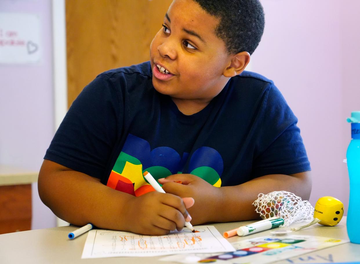 A fourth-grader works with a therapist at Best Point Education and Behavioral Health in Madisonville on June 13. The nonprofit has a long waiting list of kids in the region who need mental health care.