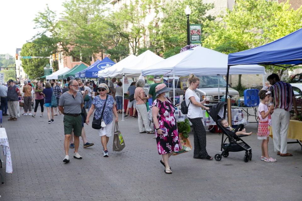 Patrons walk around the Lafayette Farmers Market on Fifth Street, Saturday, June 12, 2021 in Lafayette.