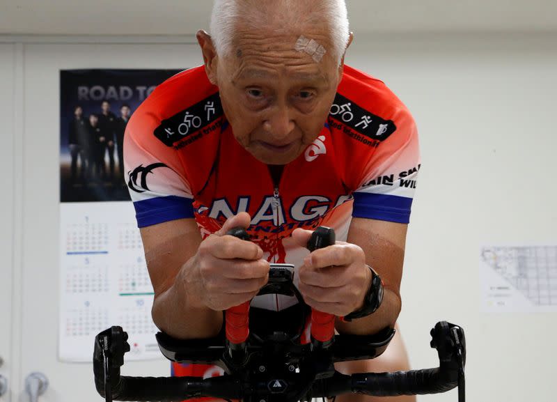 Hiromu Inada, redord holder of the oldest person to complete an Ironman World Championship, works out on his bike in Chiba, Japan