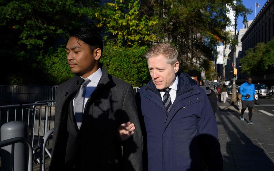 Actor Anthony Rapp (R) and his partner Ken Ithiphol arrive to court - AFP