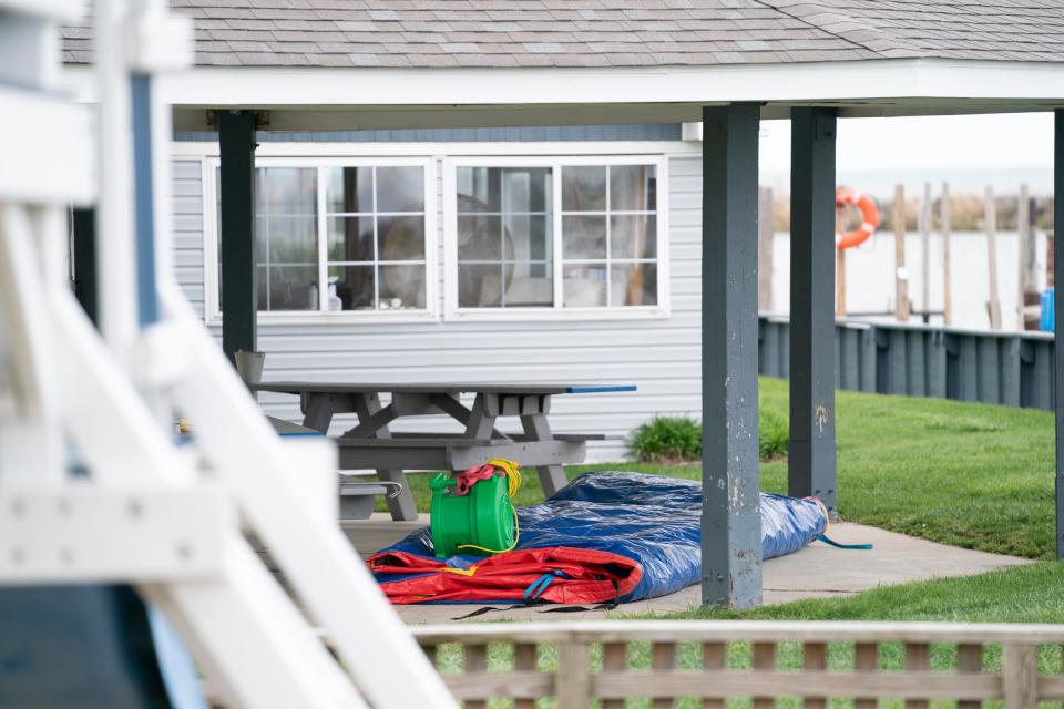 A deflated bounce house was part of a birthday party left at a scene of the Swan Boat Club in Newport on Sunday, April 21, 2024 where an alleged drunken driver smashed through a wall at the club during a child's birthday party on Saturday.