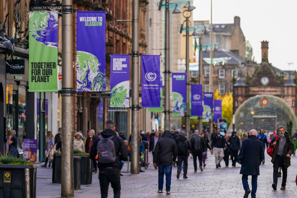 Banners advertising the upcoming COP26 climate talks line a precinct in Glasgow, U.K., on Wednesday, Oct. 20, 2021.<span class="copyright">Ian Forsyth—Bloomberg/Getty Images</span>