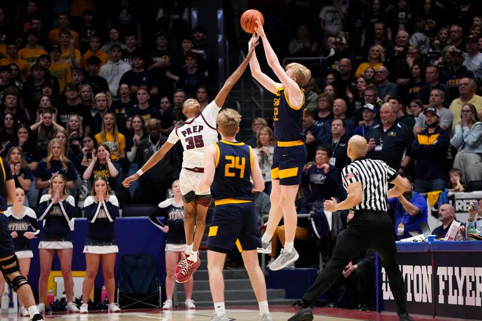 Mar 22, 2024; Dayton, Ohio, USA; On the final play of the game, Harvest Prep forward Ephraim Campbell (35) guards Ottawa-Glandorf guard Colin White (22) during the second half of the OHSAA Div. III boys basketball state semifinal at University of Dayton Arena. Harvest Prep won 61-59.