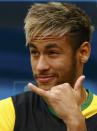 Brazil's Neymar gestures on the bench before the start of their 2014 World Cup third-place playoff against the Netherlands at the Brasilia national stadium in Brasilia July 12, 2014. REUTERS/Dominic Ebenbichler (BRAZIL - Tags: SOCCER SPORT WORLD CUP)