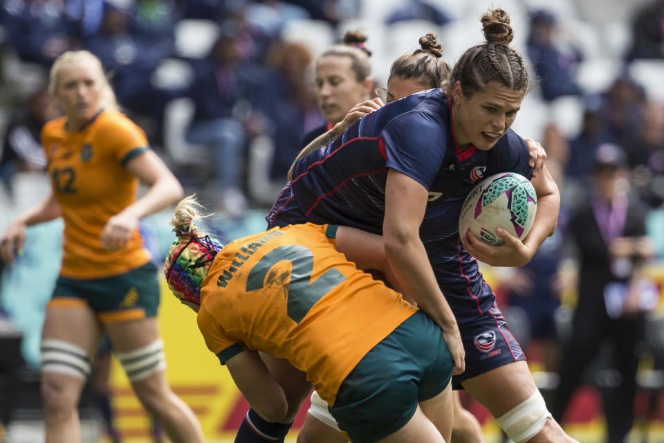 FILE - Ilona Maher of USA is tackled by Sharni Williams of Australia in a semifinal of the Rugby World Cup 7's championship held in Cape Town, South Africa, Sunday, Sept. 11, 2022. The main task for Maher, the breakout social media star on TikTok at the Tokyo Olympics, is winning a medal in Paris. (AP Photo/Halden Krog, File)