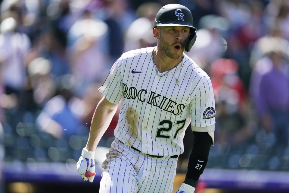 Colorado Rockies' Trevor Story circles the bases ater hitting a grand slam off Philadelphia Phillies relief pitcher David Hale in the fourth inning of a baseball game Sunday, April 25, 2021, in Denver. (AP Photo/David Zalubowski)