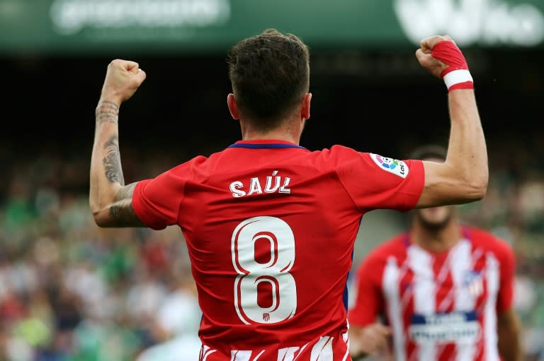 Atletico Madrid's midfielder Saul Niguez celebrates after scoring a goal during the Spanish league football match against Real Betis December 10, 2017