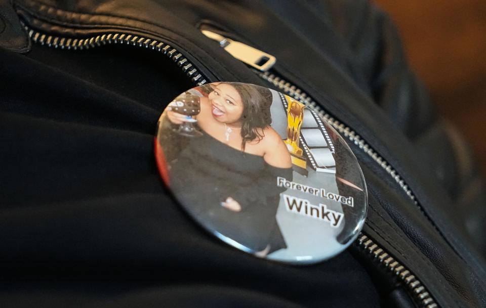 Secoya Williams' uncle, James Harney, wears a button that reads "Forever Loved Winky." It is a tribute to the 25-year-old Indianapolis woman who was killed in a shooting Feb. 25, 2022.