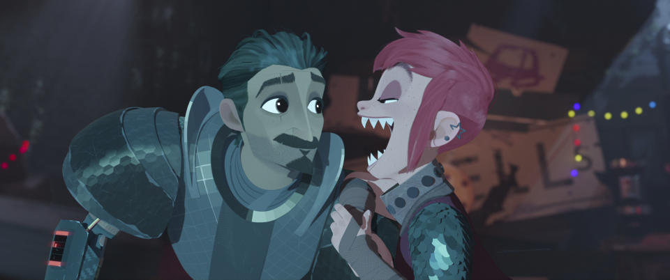 This image released by Netflix shows characters Ballister Boldheart, voiced by Riz Ahmed, left, and Nimona, voiced by Chloë Grace Moretz, in a scene from the animated film "Nimona." (Netflix via AP)