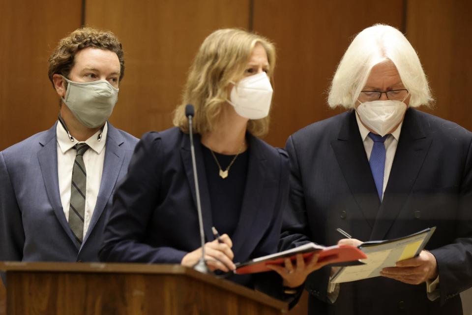 Actor Danny Masterson, left, stands with his lawyers Thomas Mesereau, right, and Sharon Appelbaum during his arraignment in Los Angeles Superior Court (AP)