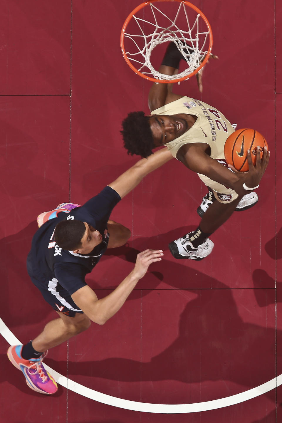 Florida State center Naheem McLeod (24) comes up with a rebound as Virginia forward Kadin Shedrick, left, defends in the first half of an NCAA college basketball game in Tallahassee, Fla., Saturday, Jan. 14, 2023. (AP Photo/Phil Sears)