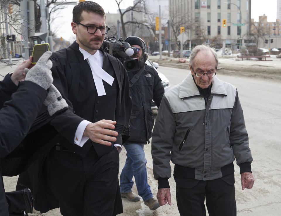 Retired priest Arthur Masse, 93, leaves the Law Courts in Winnipeg, Thursday, March 30, 2023 after a judge acquitted him of forcing himself on a residential school student more than 50 years ago, saying she believes an assault happened but could not determine beyond a reasonable doubt who did it. (David Lipnowski /The Canadian Press via AP)