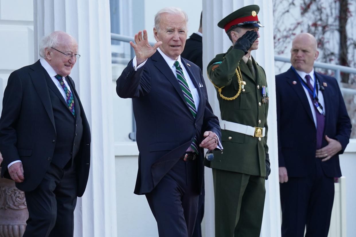 Higgins walks behind Biden as the US president departs following a meeting at Aras an Uachtarain (PA Wire)