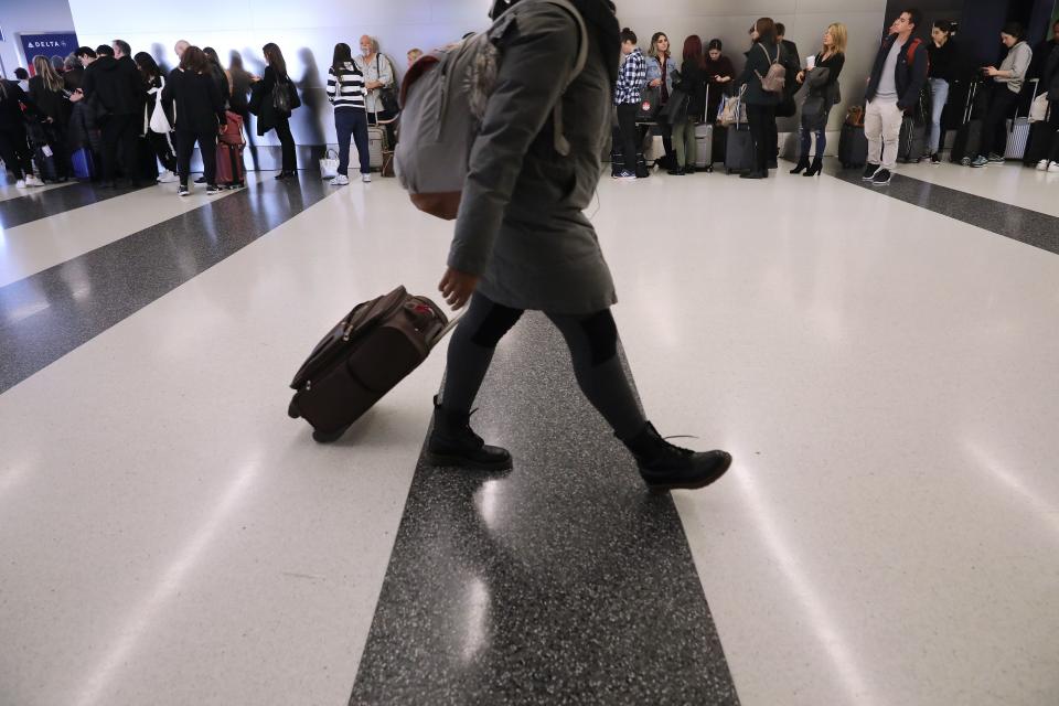 Passengers wait to board a flight to Las Vegas at New York's JFK Airport on Nov. 21, 2018.